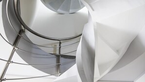 A modern, geometric interior design with a metallic spiral staircase and white walls. - Casa Borgo Regina B&B Bari (Noicattaro)