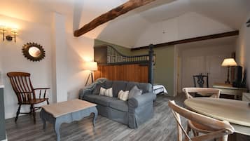 Comfort Cottage, 1 Bedroom | Living area | 35-inch flat-screen TV with digital channels, TV, DVD player