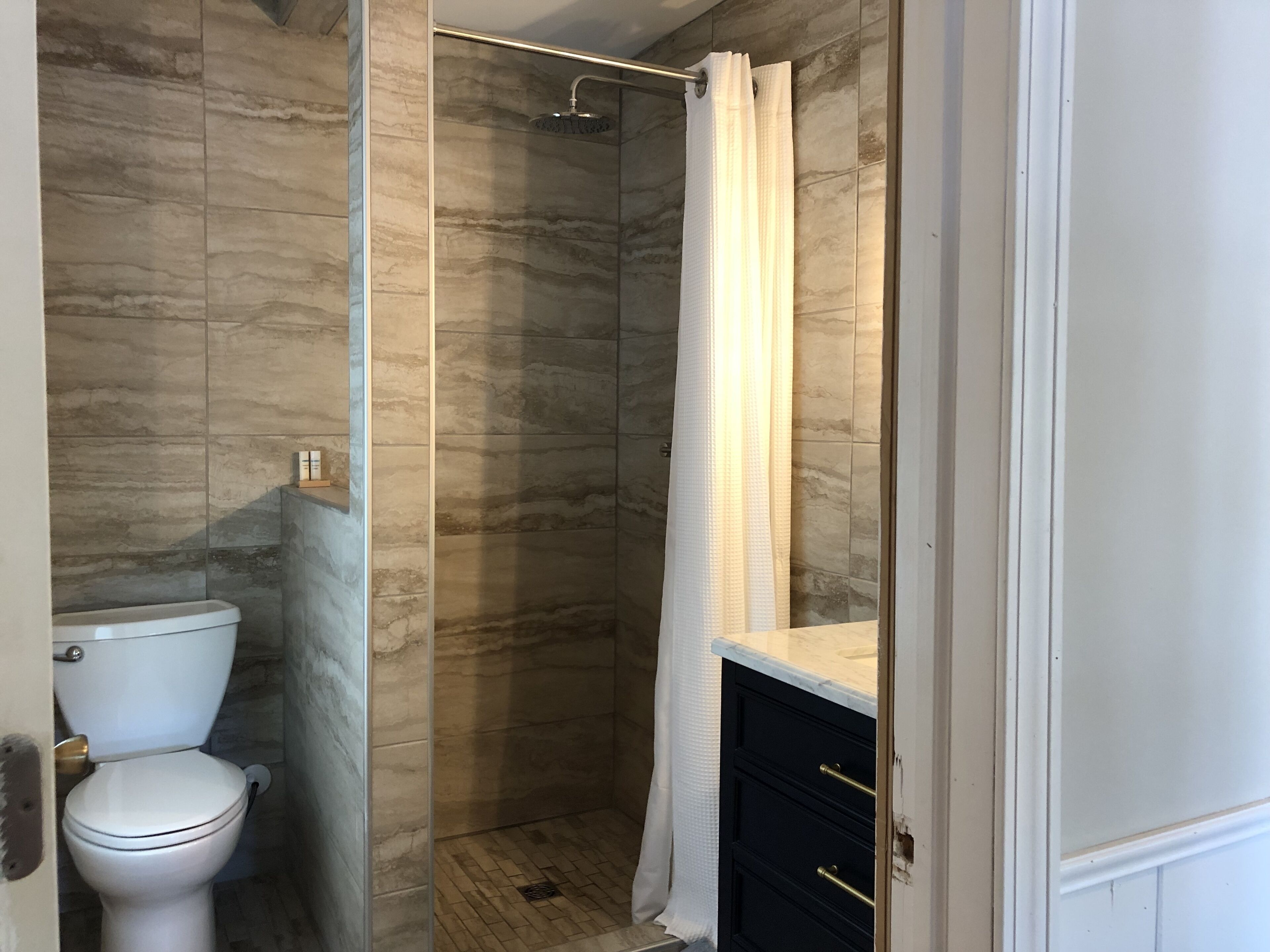 Shower, towels, soap, toilet paper