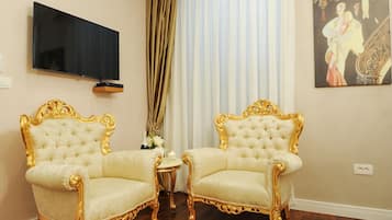Deluxe Double Room, Balcony | Living area | Flat-screen TV