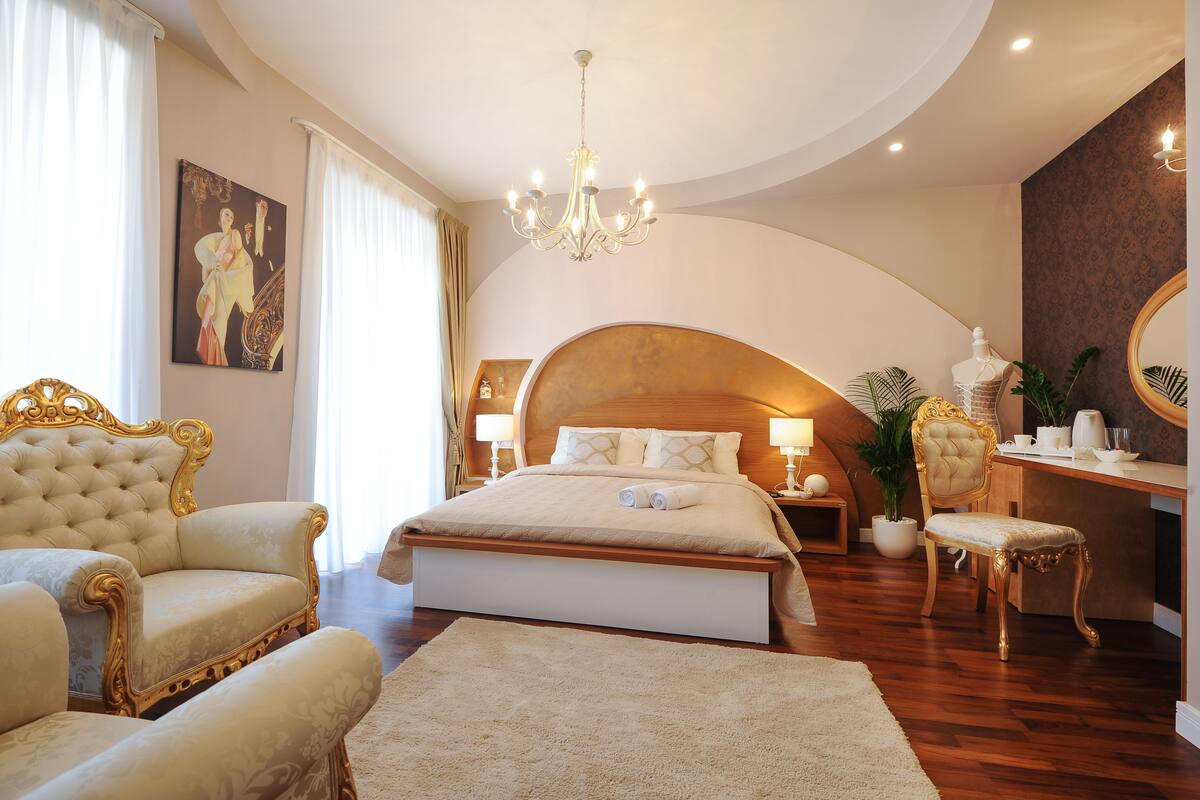 Deluxe Double Room, Balcony | In-room safe, desk, laptop workspace, blackout drapes