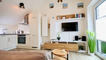 Sonnengarten 11 | Living area | Flat-screen TV
