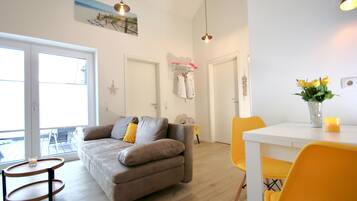 Sonnengarten 11 | Living area | Flat-screen TV