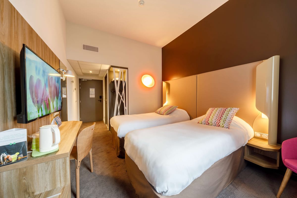 Premium bedding, laptop workspace, blackout drapes, soundproofing