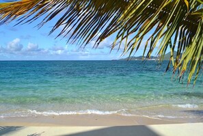 On the beach, sun loungers, beach towels