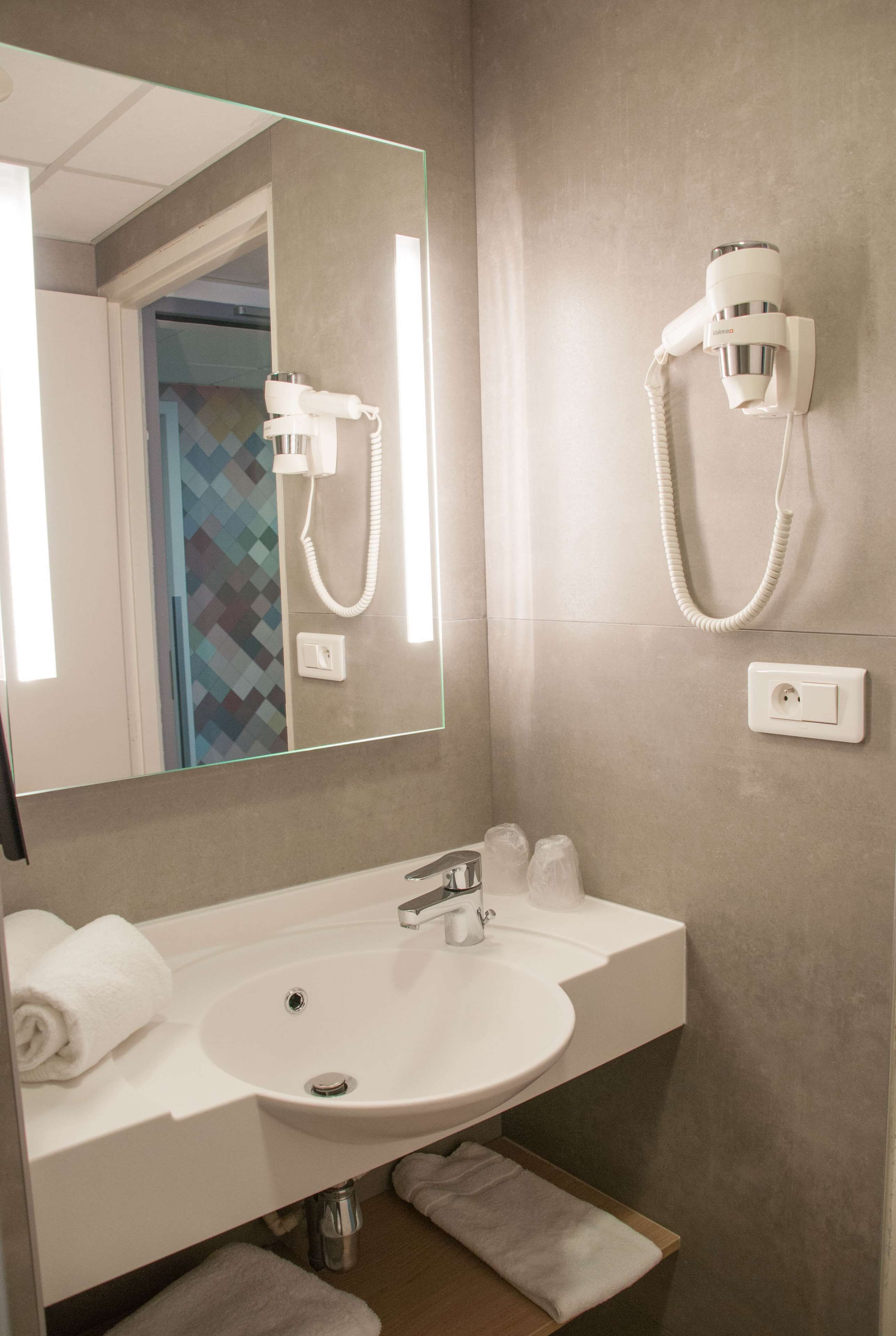 shower, eco-friendly toiletries, hair dryer, towels