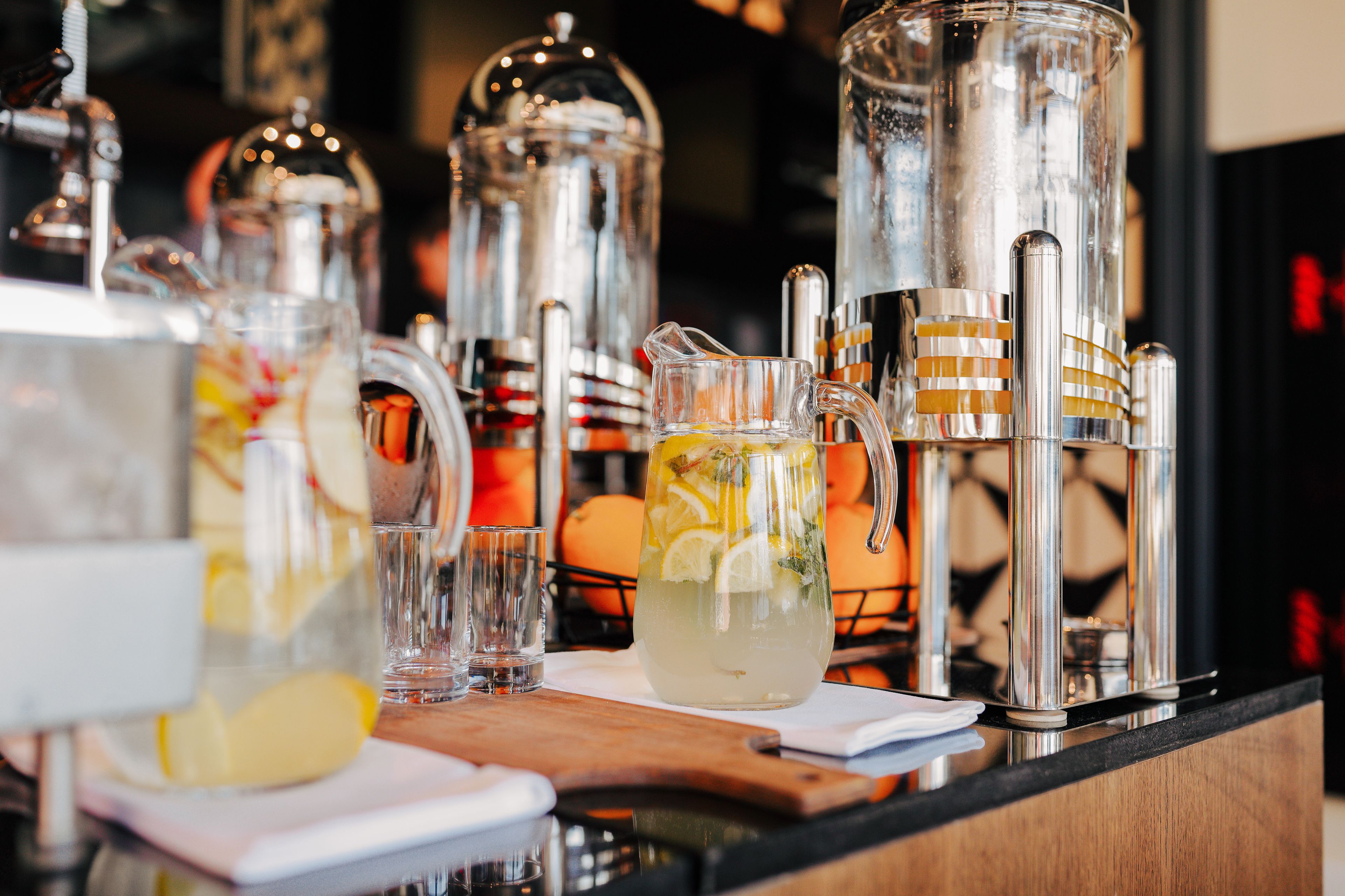 A bar area with various glassware and pitchers, likely for making cocktails or drinks.