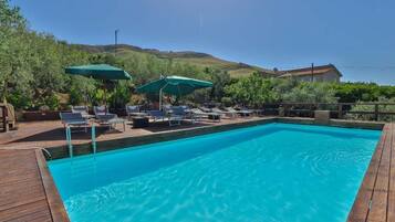 Seasonal outdoor pool, pool loungers