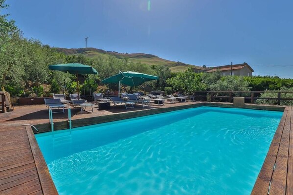 Seasonal outdoor pool, pool loungers