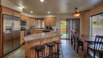 Premier Townhome | Private kitchen | Fridge, microwave, stovetop, dishwasher