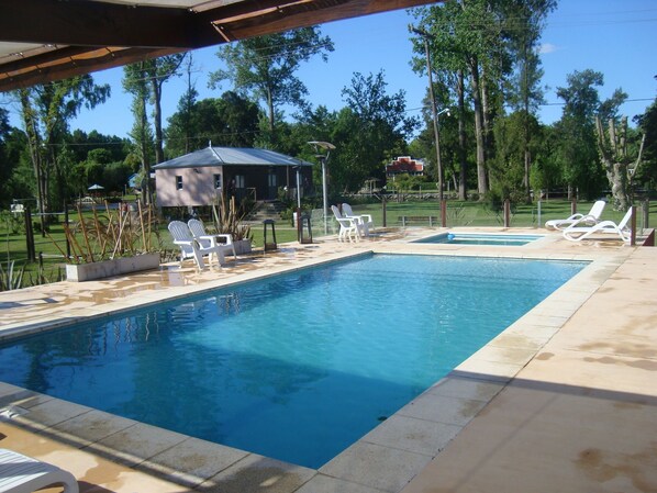Seasonal outdoor pool, open 10:00 AM to 8:00 PM, sun loungers