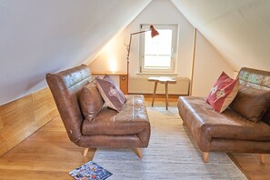 TV, fireplace, books