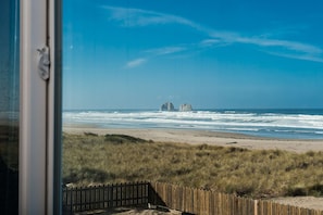 Enjoy breathtaking views of the ocean and surrounding rock formations from this beachside retreat.