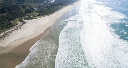Large Deck at this Oceanfront home with Views of Twin Rocks, Beach and Lake