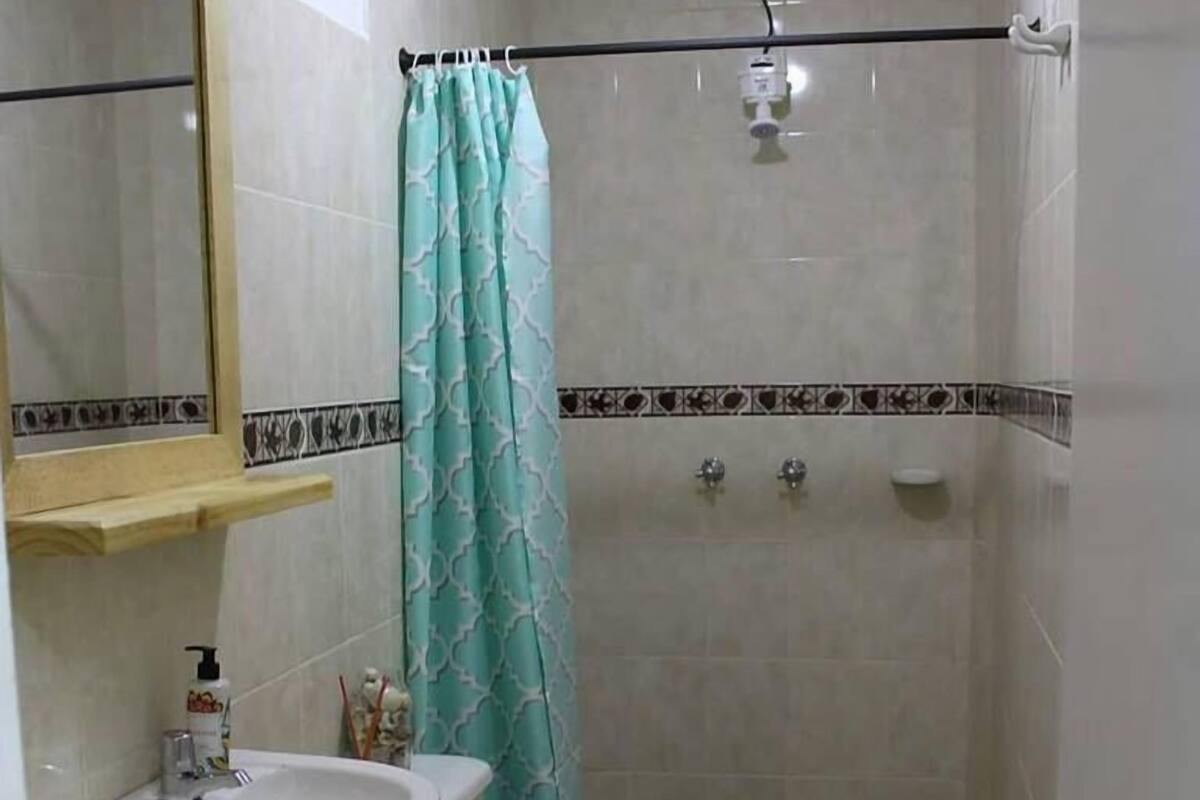 Shower, rainfall showerhead, towels, toilet paper