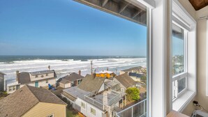A coastal residential area with houses and a view of the ocean. - Sweeping ocean views for your families getaway with easy access to great beaches (Lincoln City)