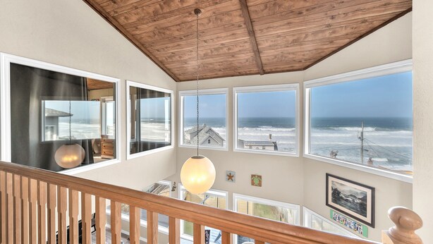 A spacious room with a high ceiling and large windows overlooking the ocean. - Sweeping ocean views for your families getaway with easy access to great beaches (Lincoln City)