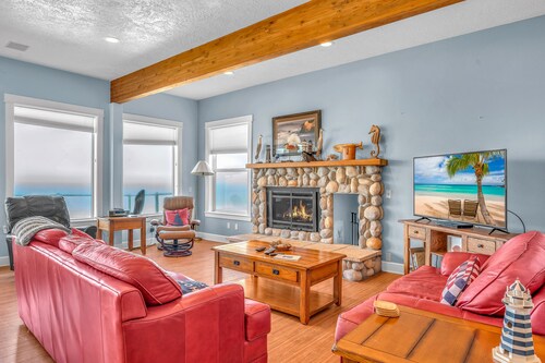 Luxury beachfront home, ocean views from inside or deck, and beach access nearby