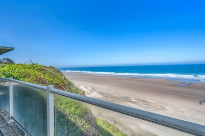 Luxury beachfront home, ocean views from inside or deck, and beach access nearby