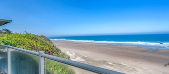 Luxury beachfront home, ocean views from inside or deck, and beach access nearby