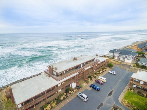Truly on the beach at this very oceanfront condo, sweeping views on the balcony!