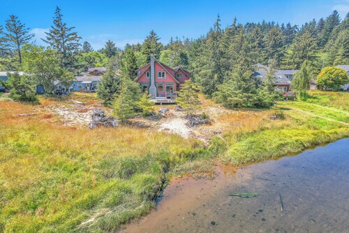 Relax on the river at this large 4 bed home, still close to town and the beach