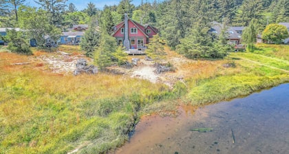 Relax on the river at this large 4 bed home, still close to town and the beach