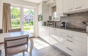 Fridge, stovetop, dishwasher, coffee/tea maker