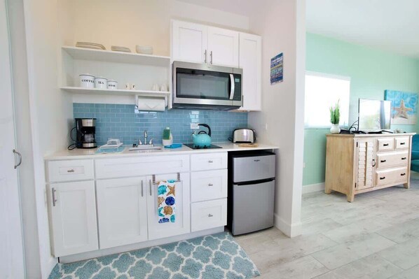 Fridge, microwave, stovetop, coffee/tea maker