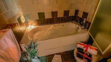 Bathtub, jetted tub, hair dryer, towels