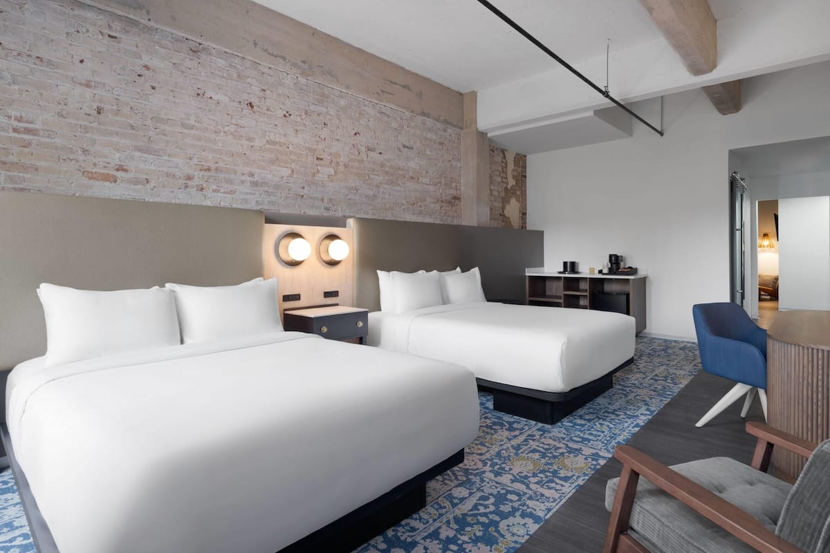 Family Suite, Multiple Beds, Roll-in Shower | Hypo-allergenic bedding, in-room safe, desk, laptop workspace