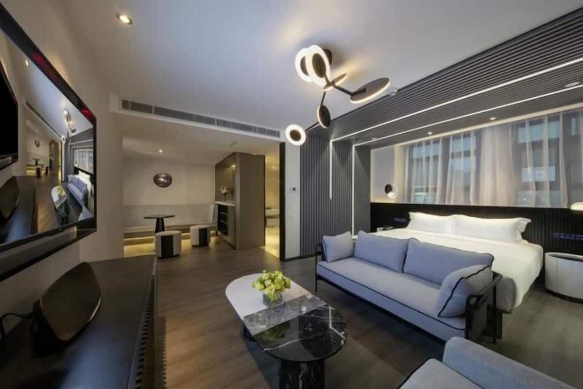 Minibar, desk, blackout curtains, iron/ironing board