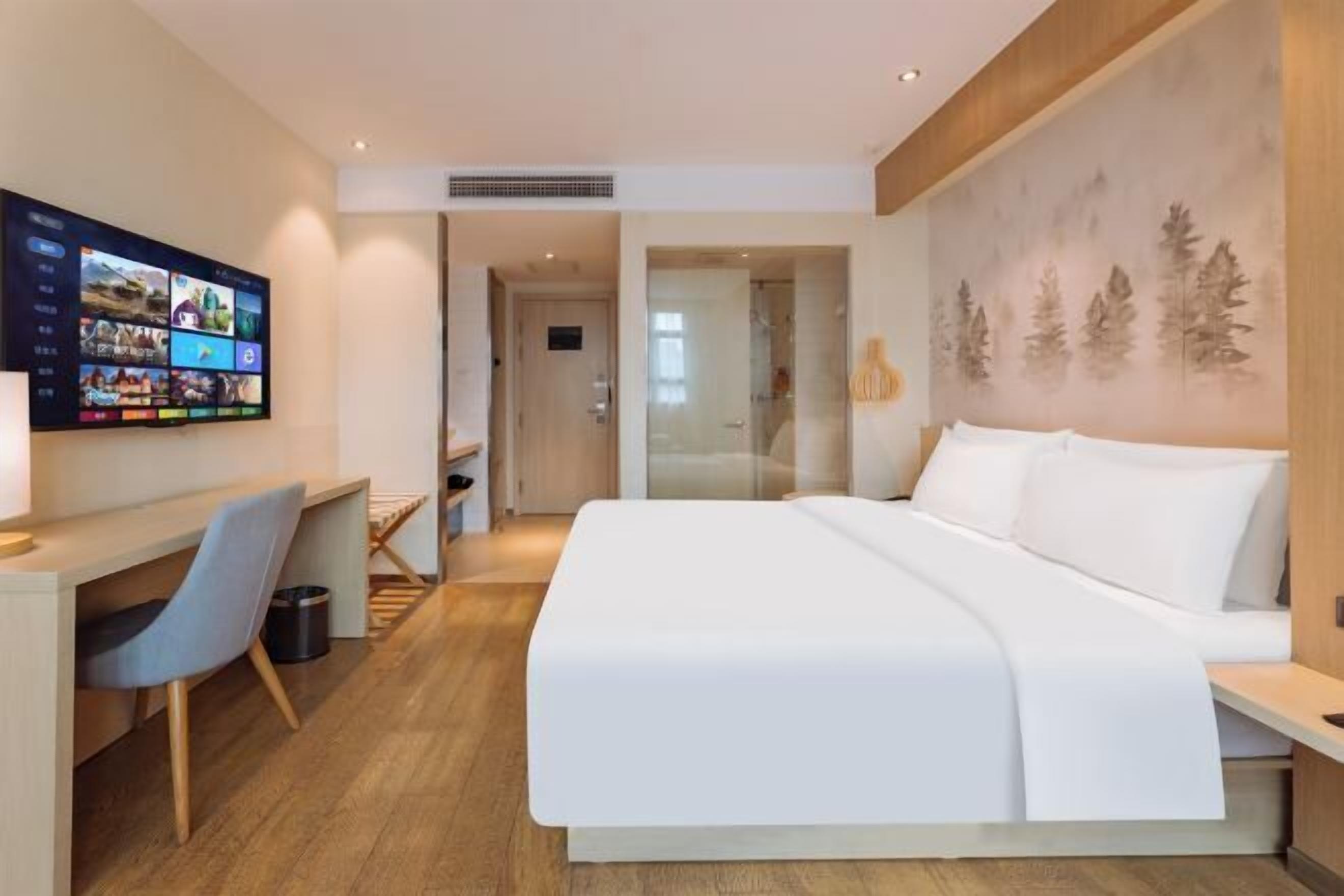 Minibar, desk, blackout curtains, iron/ironing board