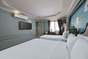 Family Quadruple Room | Minibar, in-room safe, desk, laptop workspace - Madelise Central Hotel & Travel (Hanoi)