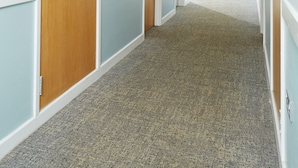 A corridor with doors, carpeted flooring, and recessed lighting. - Warwick Conferences - Central Campus Venues  (Coventry)