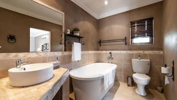 Separate tub and shower, deep soaking tub, free toiletries, towels