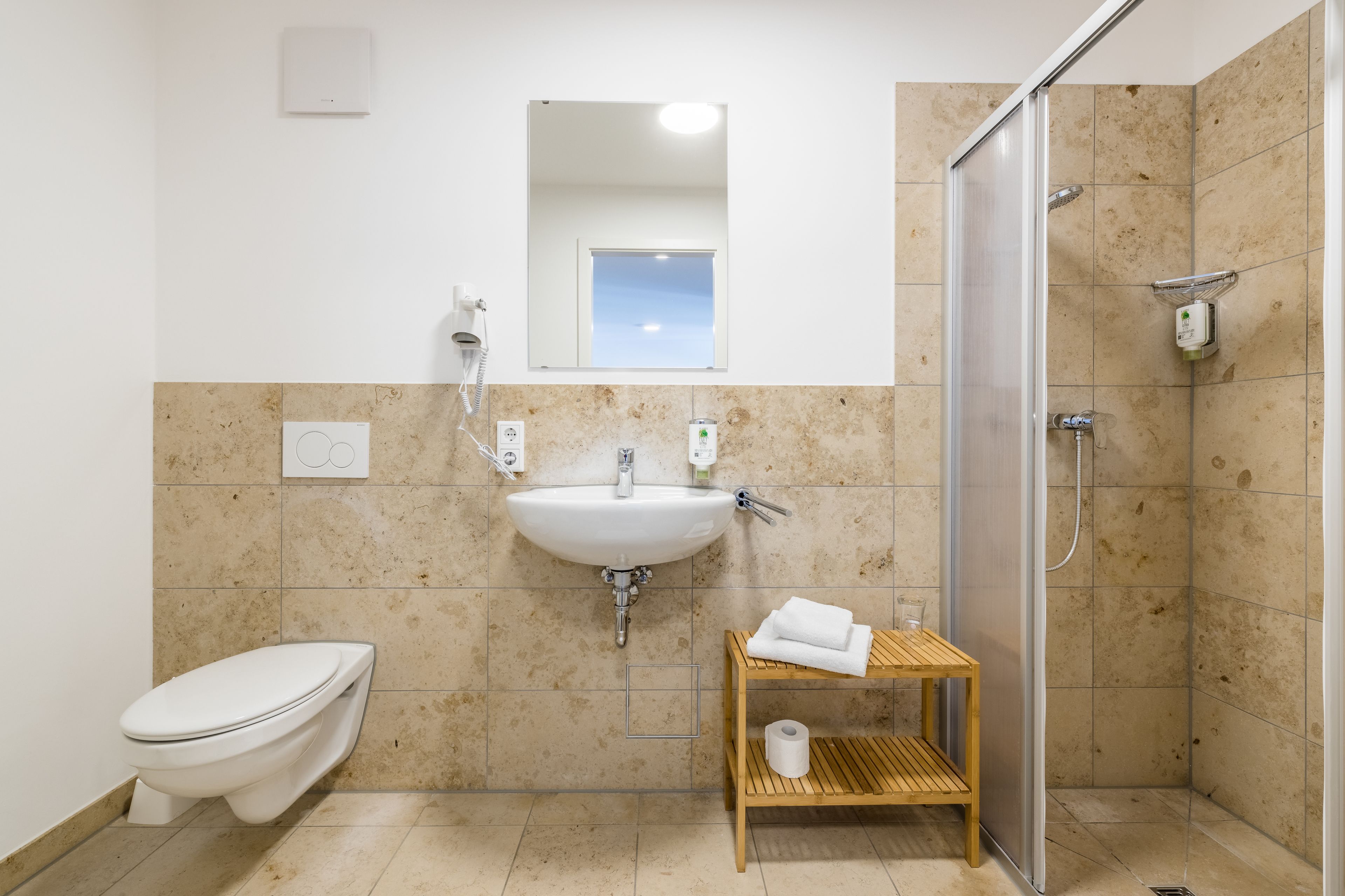 shower, hair dryer, towels, soap