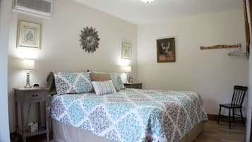 1 bedroom, desk, iron/ironing board, travel crib
