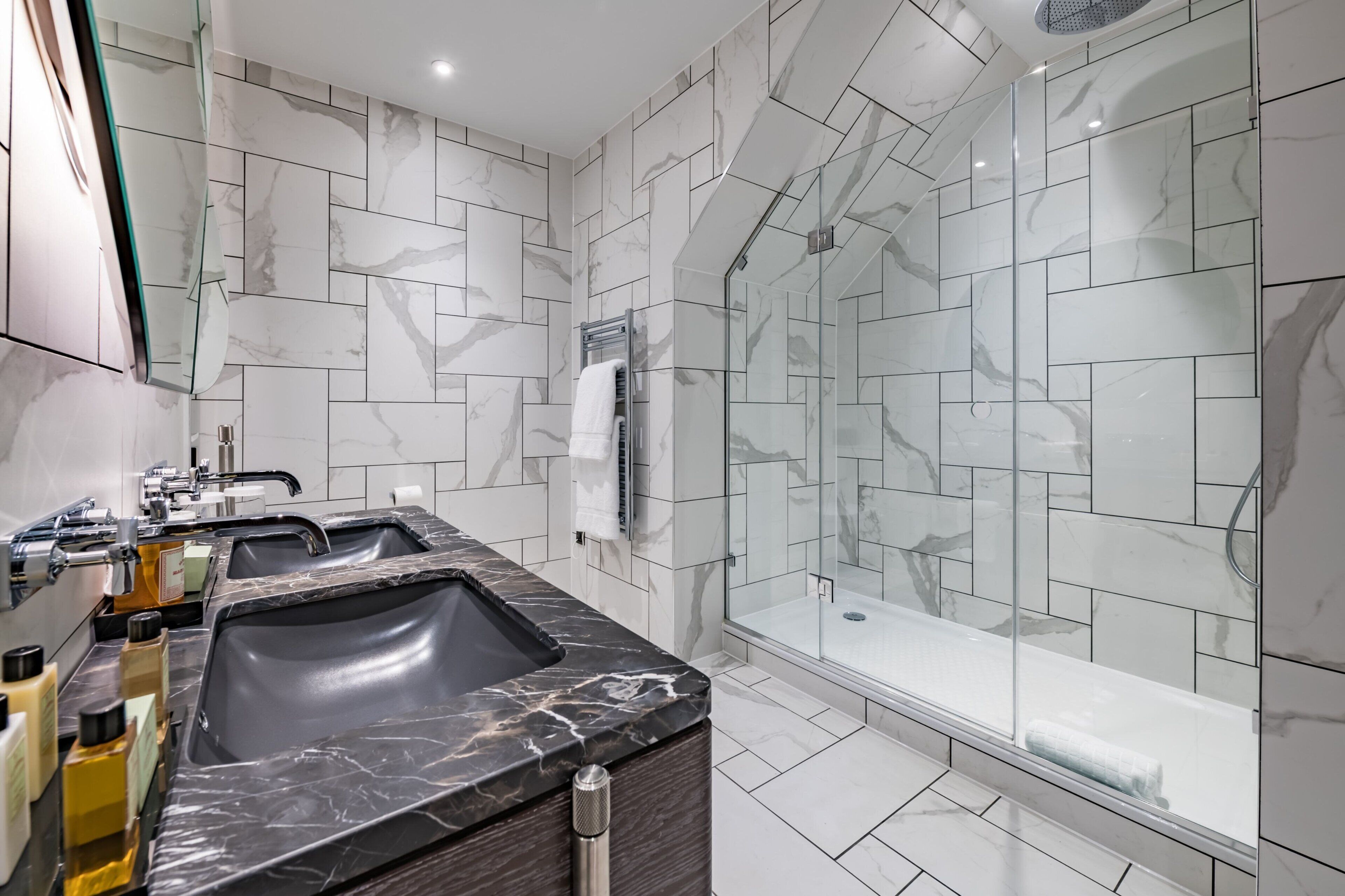 designer toiletries, hair dryer, bathrobes, slippers