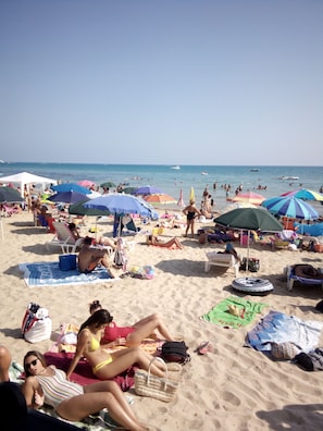 A crowded beach with numerous umbrellas and people relaxing on the sand. - Al Faro (Realmonte)