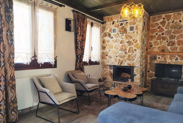 Comfort Apartment | Living area | -29-inch flat-screen TV with satellite channels, Smart TV, fireplace - Stone Built Rustic House (Rhodes)