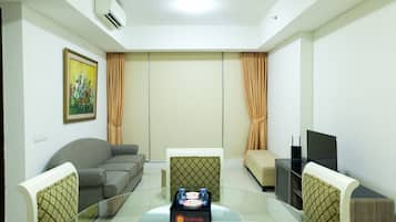 Quarto | Área de estar | TV