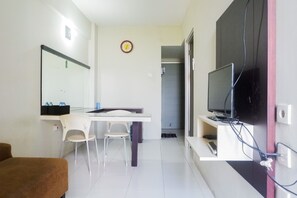 Room | Living area | TV - Pool View 2BR at Dian Regency Apartment (Surabaya)