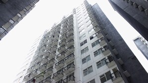A high-rise building with multiple balconies and windows. - Strategic 1BR Apartment with Sofa Bed at The Jarrdin Cihampelas (Bandung)