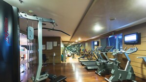 A gym with cardio machines, weight machines, and a treadmill. - DoubleTree by Hilton Ankara Ankamall (Ankara)