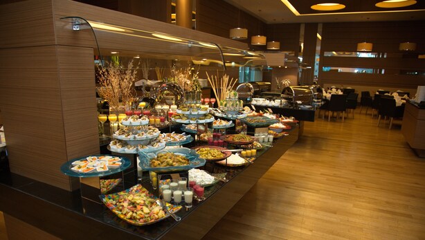 A buffet with various food items and drinks. - DoubleTree by Hilton Ankara Ankamall (Ankara)