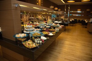 A buffet with various food items and drinks. - DoubleTree by Hilton Ankara Ankamall (Ankara)