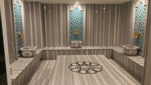A modern bathroom with a central heated floor, two sinks, and decorative tiles. - DoubleTree by Hilton Ankara Ankamall (Ankara)