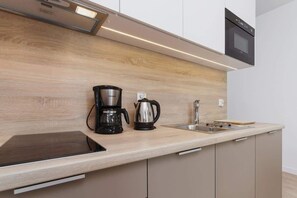 Fridge, microwave, stovetop, coffee/tea maker