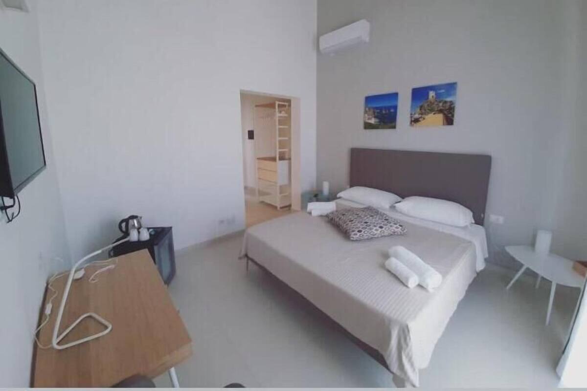 Exclusive Room, Sea View (Faraglioni) | Premium bedding, down duvets, memory-foam beds, minibar